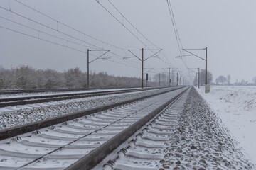 german train in snow an winter, trails of the german train with winter landscape during heavy snowfall