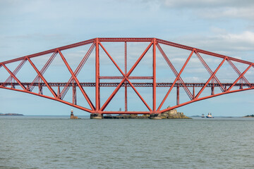 The centre double cantilever tower of the iconic red Forth Bridge from the side