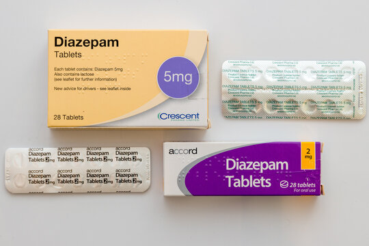 Boxes and blister packs of generic brands of 2mg and 5mg Diazepam tablets on white background