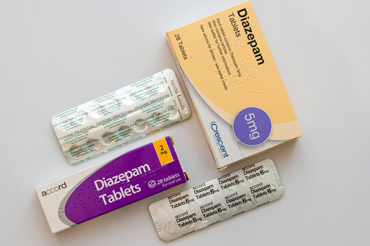 Boxes and blister packs of generic brands of 2mg and 5mg Diazepam tablets on white background