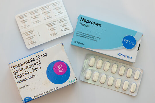Box and blister pack of generic 500mg Naproxen tablets and 30mg Lansoprazole capsules, often prescribed together