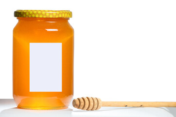 Fresh honey in a jar on clean white background