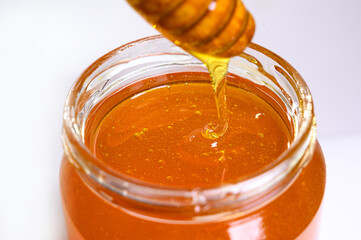 Fresh honey on clean background