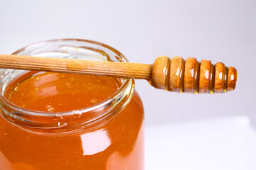 Fresh honey on clean background