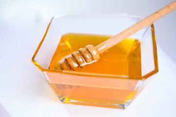 Fresh honey on clean background