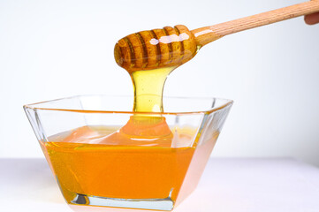 Fresh honey on clean background