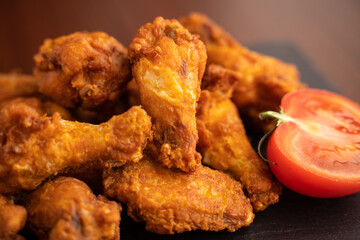Hot chicken wings with honey and parmeisane cheese