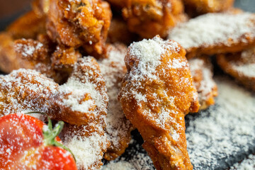 Hot chicken wings with honey and parmeisane cheese