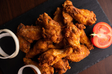 Hot chicken wings with honey and parmeisane cheese