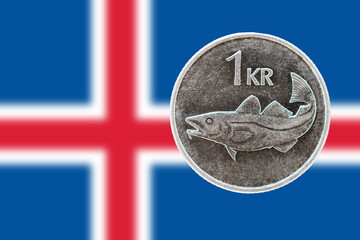 1 Icelandic krona and flag of Iceland in background - ISK