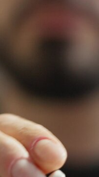 Man Using Nicotine Gum To Quit Smoking