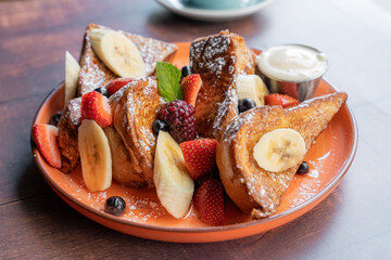 Delicious and spongy french toast with red berries