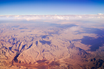 By flying to Los Angeles, you can see the sky over the Nevada deserts. The deserts lead to places...
