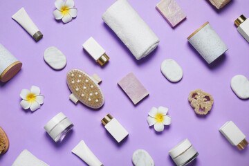 Spa essentials on violet background, flat lay