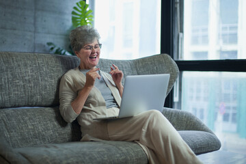 Woman concentrating as she works on a laptop