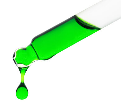 Dripping green facial serum from pipette on white background, closeup