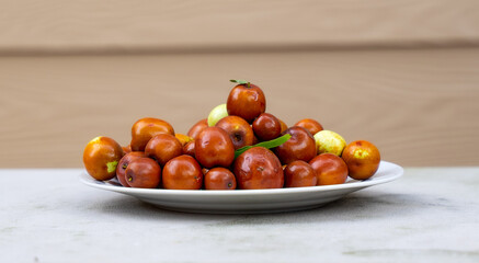 Jujube is in season. Jujube is extremely beneficial to one's health. It can be eaten at various stages, from green to brown fresh to dried. It is also used as a blood pressure medication by Asians.