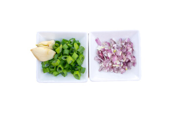 Preparation to cook Vietnamese fried rice. Ingredients are chopped carrot, hams, mushrooms and eggs. Chopped scallion, shallots and garlics are used for aroma purposes. 