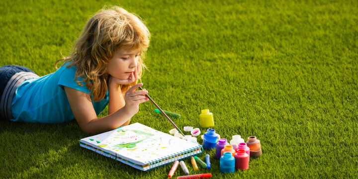 Artist kids. Schooler kids drawing in summer park, painting art. Spring and kid. Banner for website header. Little painter draw pictures outdoor.
