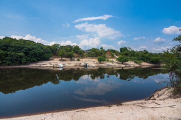 Fototapeta na wymiar View of a calm and beautiful lake close to the Praia da Lua (Moon Beach) - Manaus, Amazonas, Brazil