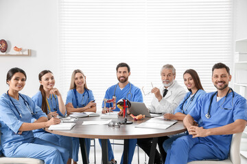 Doctor and interns on lecture in university