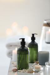 Soap dispensers and decor elements on table