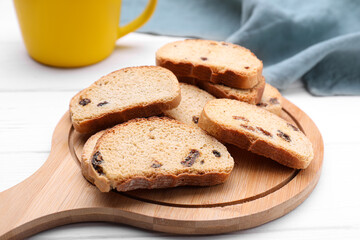 Sweet hard chuck crackers with raisins on white wooden table