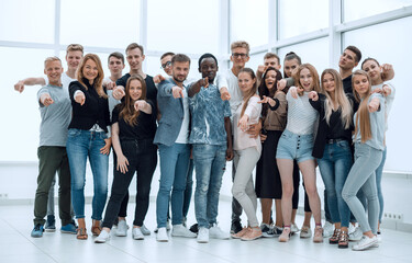 group of happy young men pointing at you.