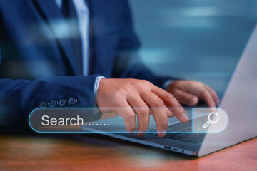 Businessman's hands are using a computer and touch the rummaging box for information. Using the search console with your website. Data routing technology search engine optimization