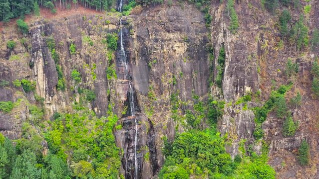 Aerial view of waterfall in the rainforest, jungle. Bambarakanda Falls, Sri Lanka