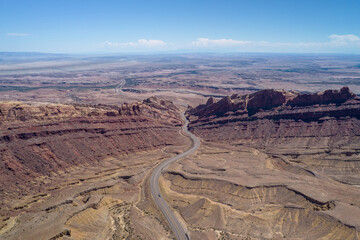 Fototapeta na wymiar Aerial view of Spotted Wolf Canyon in Utah state on interstate 70. Traffic in Black Dragon Canyon I-70 during a great weather. 