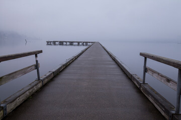Fototapeta premium Dock surrounded by heavy fog in winter in Bothell, WA 