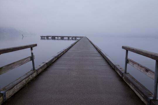 Dock surrounded by heavy fog in winter in Bothell, WA

