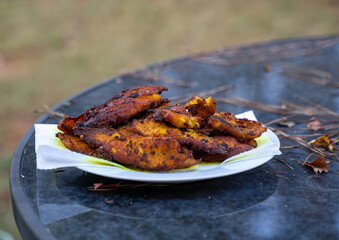 Fried fish with lemongrass and chilli peppers. Tilapia fish fillets are cleaned, dried, then fermented with lemongrass, salt, sugar, turmeric and chilli pepper. Give them an hour to marinate thoroughl