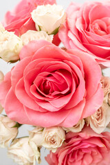 Coral roses and blush pink spray roses 