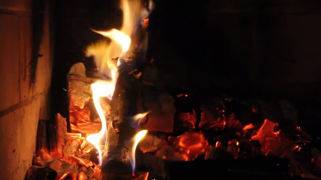 Black Stainless Steel Bbq Grill Shovel Moving Burning Charcoal and Firewood While a Man is Preparing an "Asado", Traditional Barbeque in the Argentine Pampas. 4K Resolution.