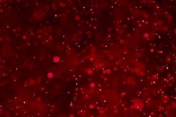 Valentine’s on dark red bokeh glitter background Ideal as wallpaper, card,wedding, Christmas theme, brochure etc., © IKT224