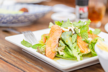 Fresh salmon salad with green vegetables