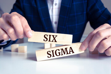 Closeup on businessman holding a wooden block with 