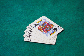Playing Card on Green Table In Casino, Flush card