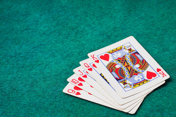 Playing Card on Green Table In Casino, Straight Flush Card