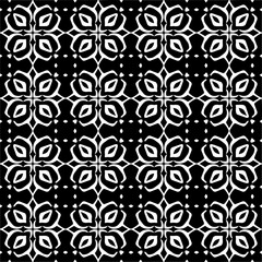 Seamless pattern of black shapes on white background.