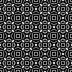 Seamless pattern of black shapes on white background.