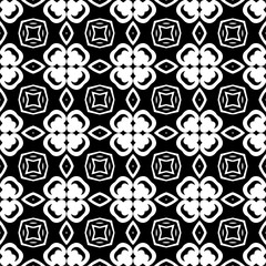 Seamless pattern of black shapes on white background.