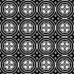 
Seamless pattern of black shapes on white background.