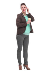 Portrait of a cheerful laughing businesswoman in suit holding take away coffee cup while talking on mobile phone