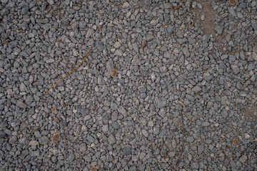 White crushed stones texture background. Gray rubble construction rock pebble pattern. 