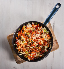 Frozen veggies in the wok for stir fry