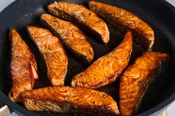 Salmon fillets in the frying pan
