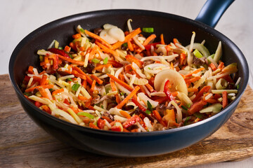 Frozen veggies in the wok for stir fry